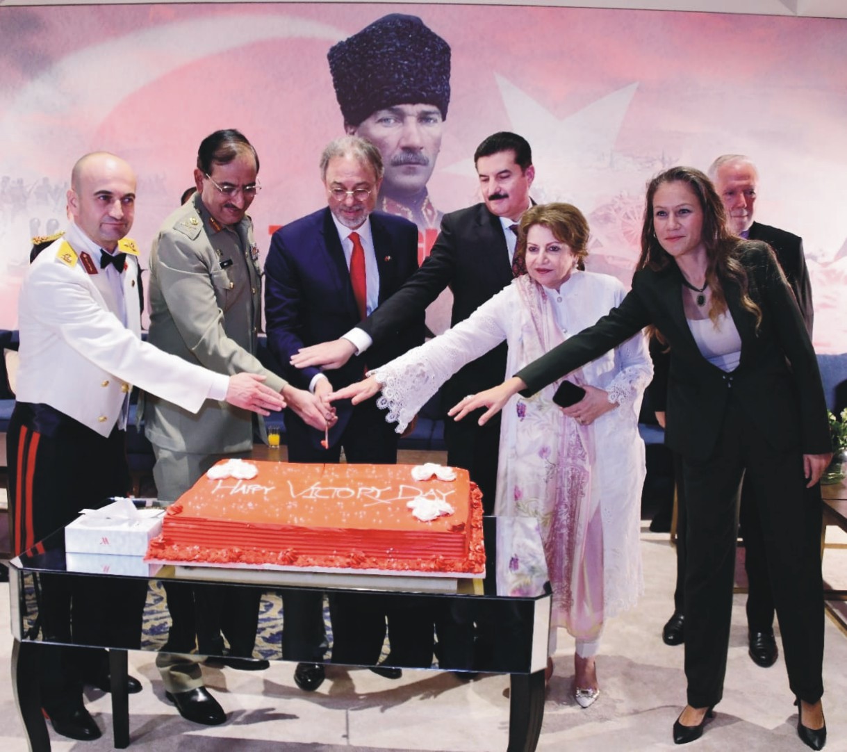 Governor Khyber Pakhtunkhwa Faisal Karim Kundi, along with Turkish Ambassador Dr. Mehmet Pacaci and other guests cutting a cake on the Victory Day of Turkey in Islamabad.