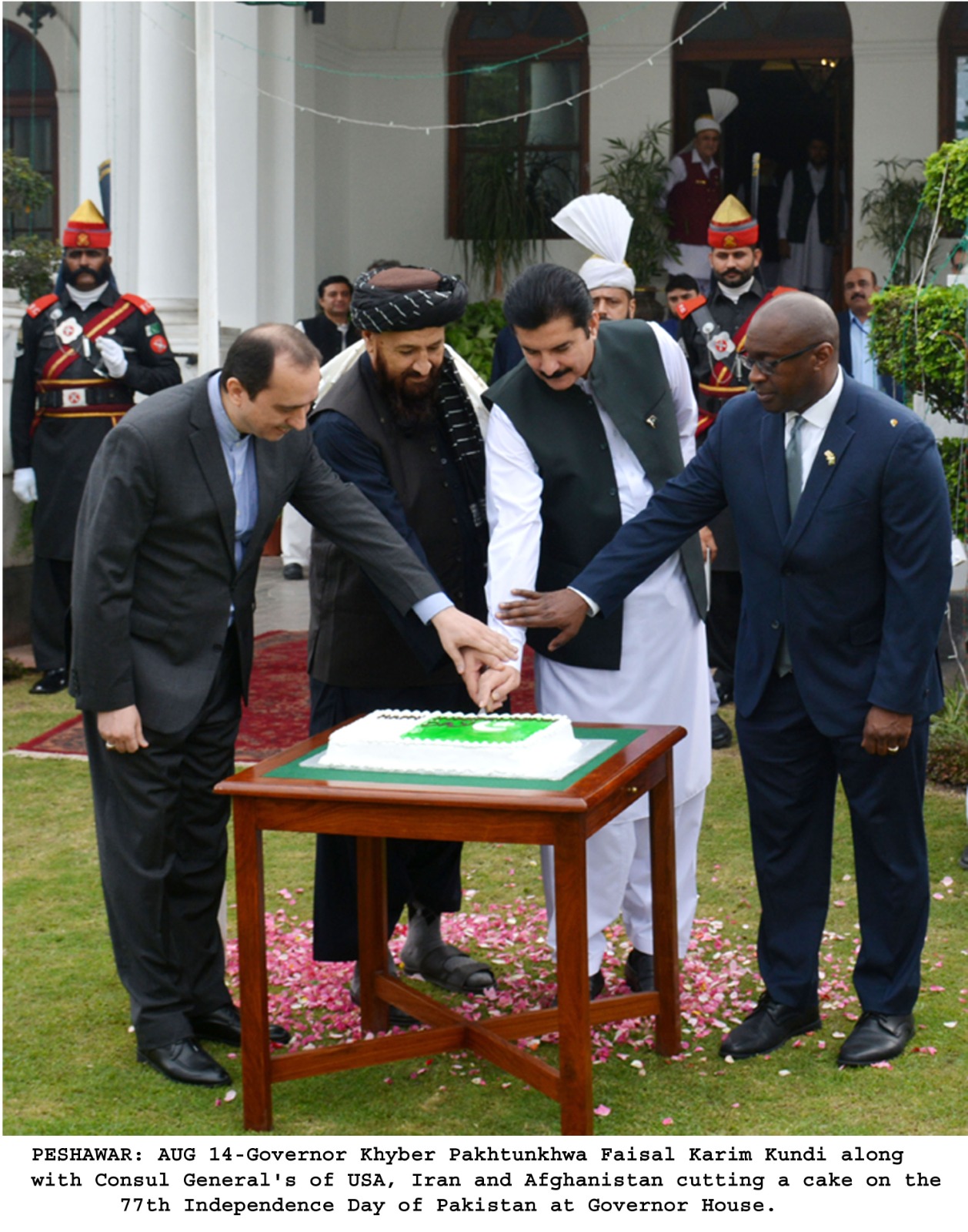 Governor Khyber Pakhtunkhwa Faisal Karim Kundi along with Consul General's of USA, Iran and Afghanistan cutting a cake on the 77th Independence Day of Pakistan at Governor House.