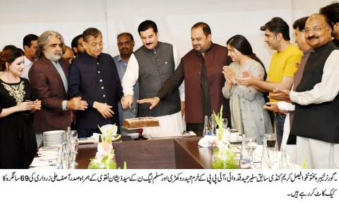 Governor Khyber Pakhtunkhwa Faisal Karim Kundi cuts a 69th Birthday  cake of  President Asif Ali Zardari in a ceremony at Rawalpindi/Islamabad.