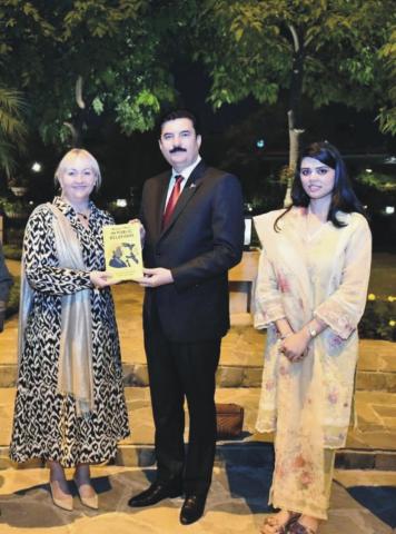 Ms. Sarah Williams, Dean of the University’s Business & Law School, Buckinghamshire, UK presents her Book to Governor Khyber Pakhtunkhwa Faisal Karim Kundi during a meeting in Islamabad.